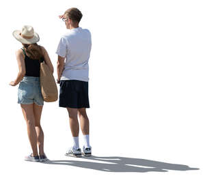 cut out man and woman leaning on a railing and looking into distance