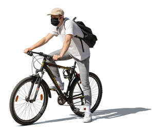 cut out young man with a face mask riding a bike