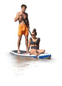 cut out man and woman riding a sup board