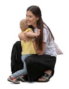 cut out 
woman squatting and hugging her son