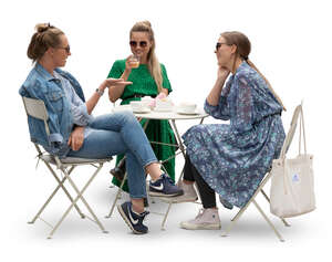 three cut out young women sitting in a cafe and talking