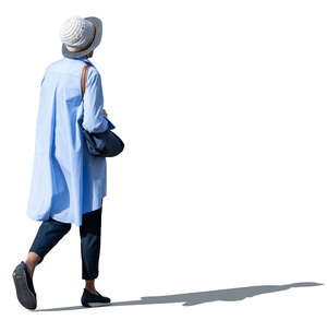 cut out woman in a light blue overcoat walking
