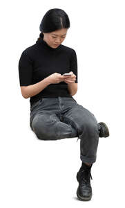 cut out woman sitting and typing something on her phone