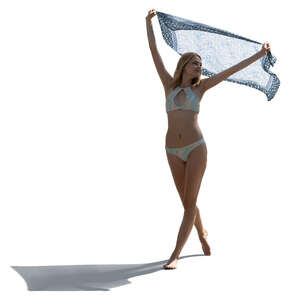 cut out backlit woman in a bikini holding a light towel up in the air