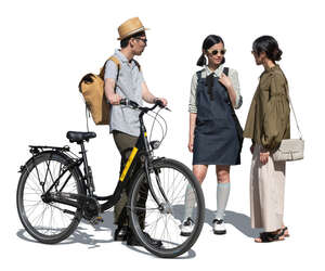 cut out man with a bicycle standing and talking to two women