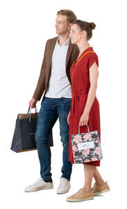 cut out man and woman with shopping bags standing 