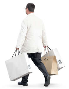 man with many big shopping bags walking