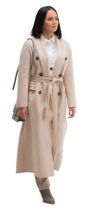 cut out woman in a beige overcoat walking
