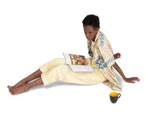 cut out woman sitting on the floor and reading