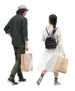 man and woman with shopping bags walking and talking