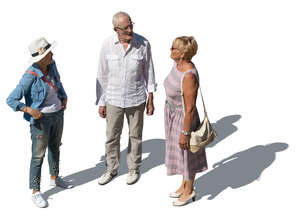 three elderly people standing seen from above