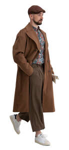 cut out man in a brown overcoat walking