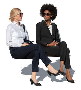 two businesswomen sitting and talking