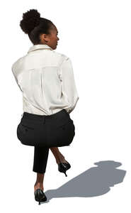 cut out businesswoman sitting seen from behind