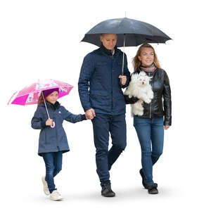 cut out family with a kid and a dog walking in the rain