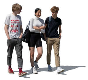 group of three young people walking
