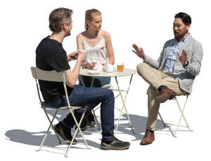 cut out group of three people sitting in a cafe and talking