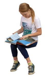 cut out girl sitting and reading a book