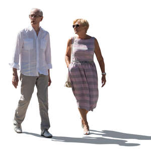 cut out backlit older man and woman walking