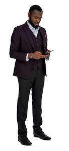 cut out man in a formal suit standing and checking his phone