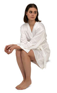 cut out woman in a white bathrobe sitting