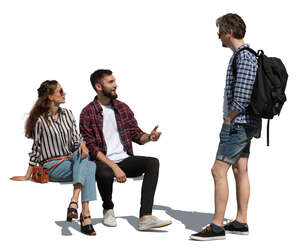 two cut out people sitting and talking to a man standing in front of them