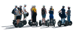 cut out backlit group of people riding segways