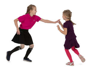 two cut out girls playing catch