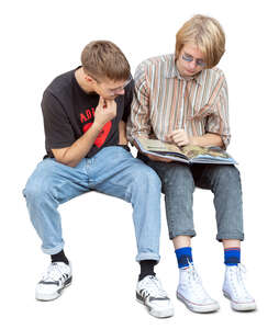 cut out teenage boys sitting and reading a book