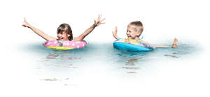 two cut out kids with swim rings playing in the water