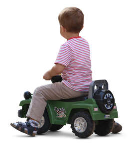 cut out little boy riding a toy car