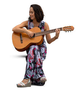 cut out woman sitting and playing a guitar