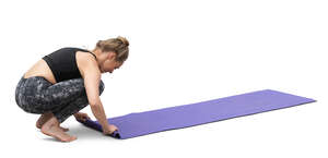 cut out woman packing her things after yoga workout