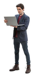 cut out man standing and holding a laptop