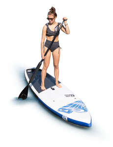 cut out woman paddleboarding seen from above