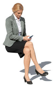 cut out businesswoman sitting outside