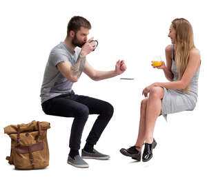 man and woman sitting in a cafe and talking