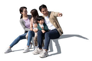 cut out chinese family with two kids sitting and looking at smth