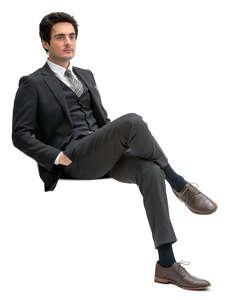 cut out man in a formal black suit sitting