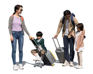 cut out family with two kids and travelling bags standing and talking