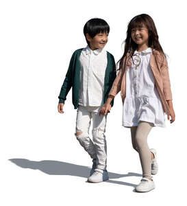 two cut out asian kids walking happily hand in hand