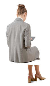cut out businesswoman working with a with a tablet sitting