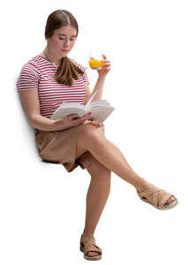 young woman sitting in a cafe and reading