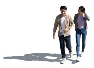 cut out asian couple walking arm in arm seen from above