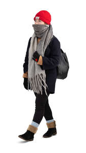 cut out teenage girl with a hat and big scarf walking