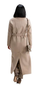 cut out woman in a long brown overcoat walking