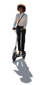 cut out backlit businesswoman riding a scooter