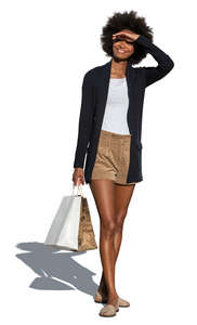 cut out woman with shopping bags standing and looking at smth