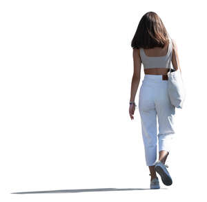 cut out young backlit woman walking