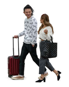 two cut out young asian people with travelling bags walking